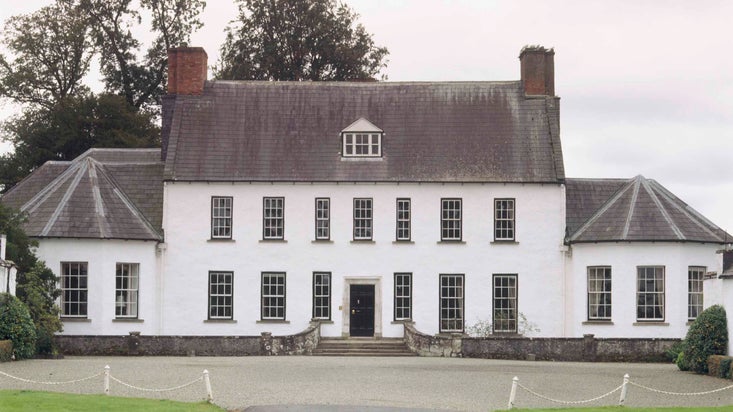 The Entrance Front of 17th century 'Planter' house, Springhill showing the whitewashed and symmetrical central block
